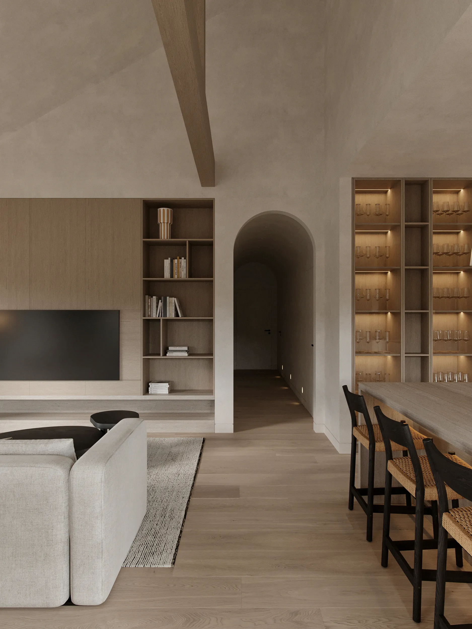 Entrance hall of the Arco home with an arched full-height mirror, travertine pedestal and pale oak wardrobes