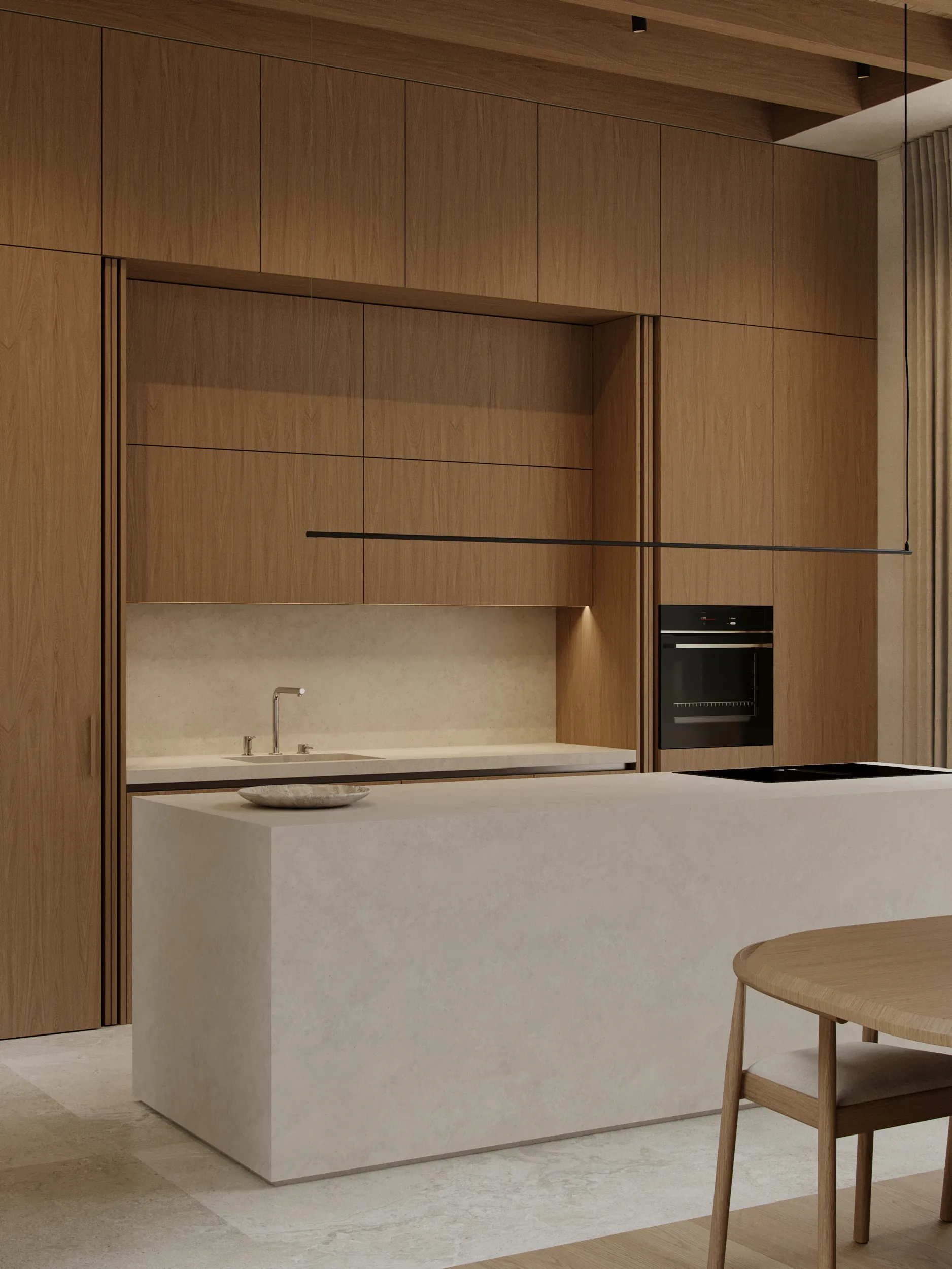 Hunters house kitchen by Ishoro in Vilnius — full-height oak cabinetry, a pale stone island and linear black pendant light