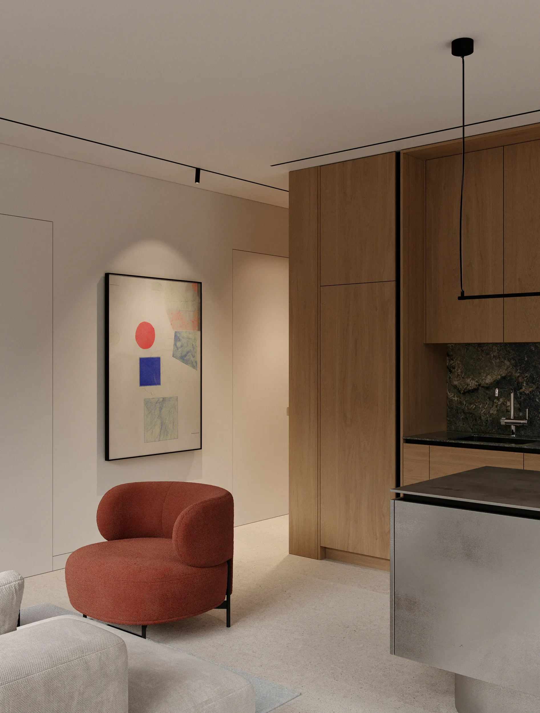 Monday apartment living room with a brick-red curved armchair, abstract artwork and built-in oak kitchen wall