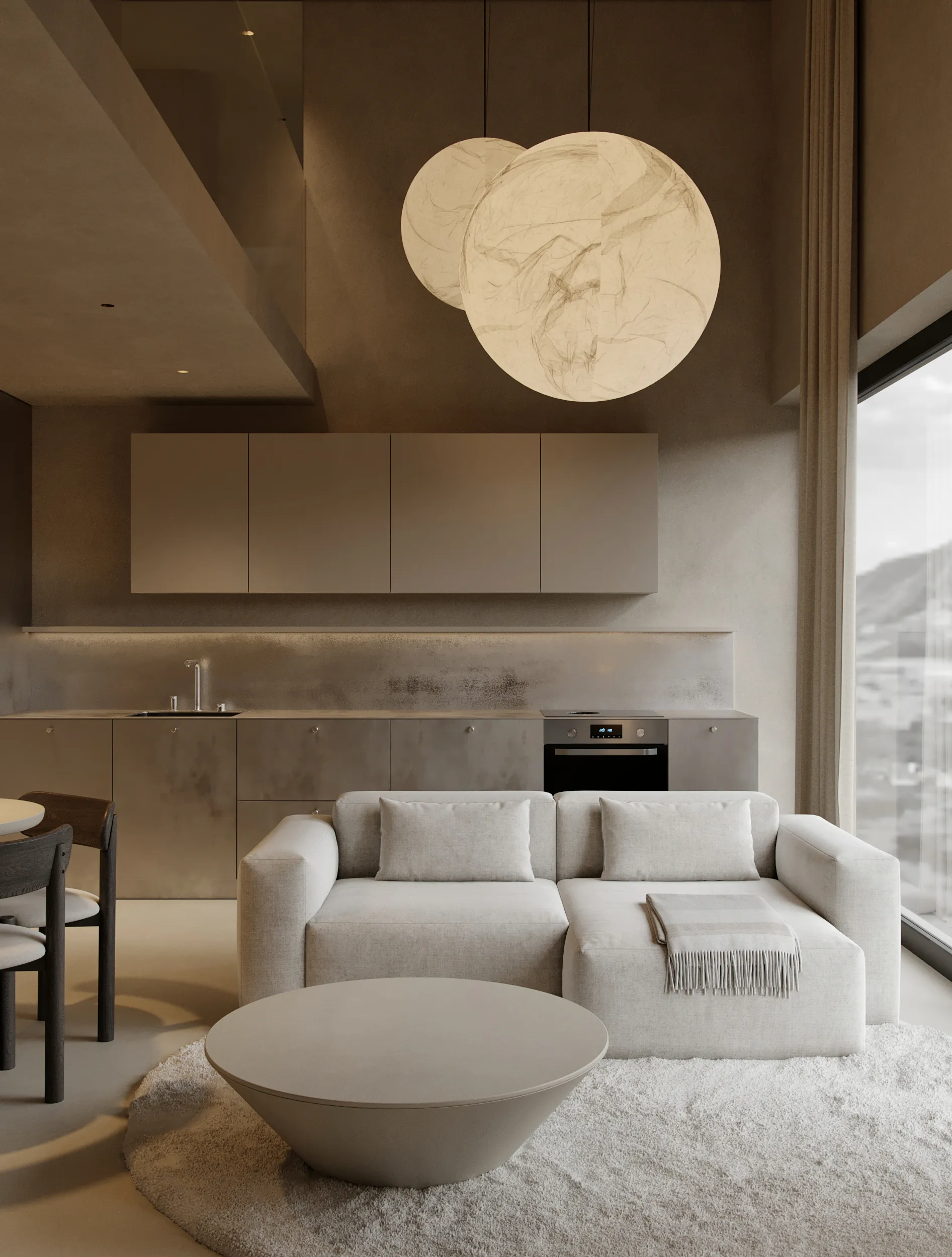 Steel apartment living space by Ishoro in Palanga — brushed-steel kitchen, cream modular sofa and paper-moon pendant lights